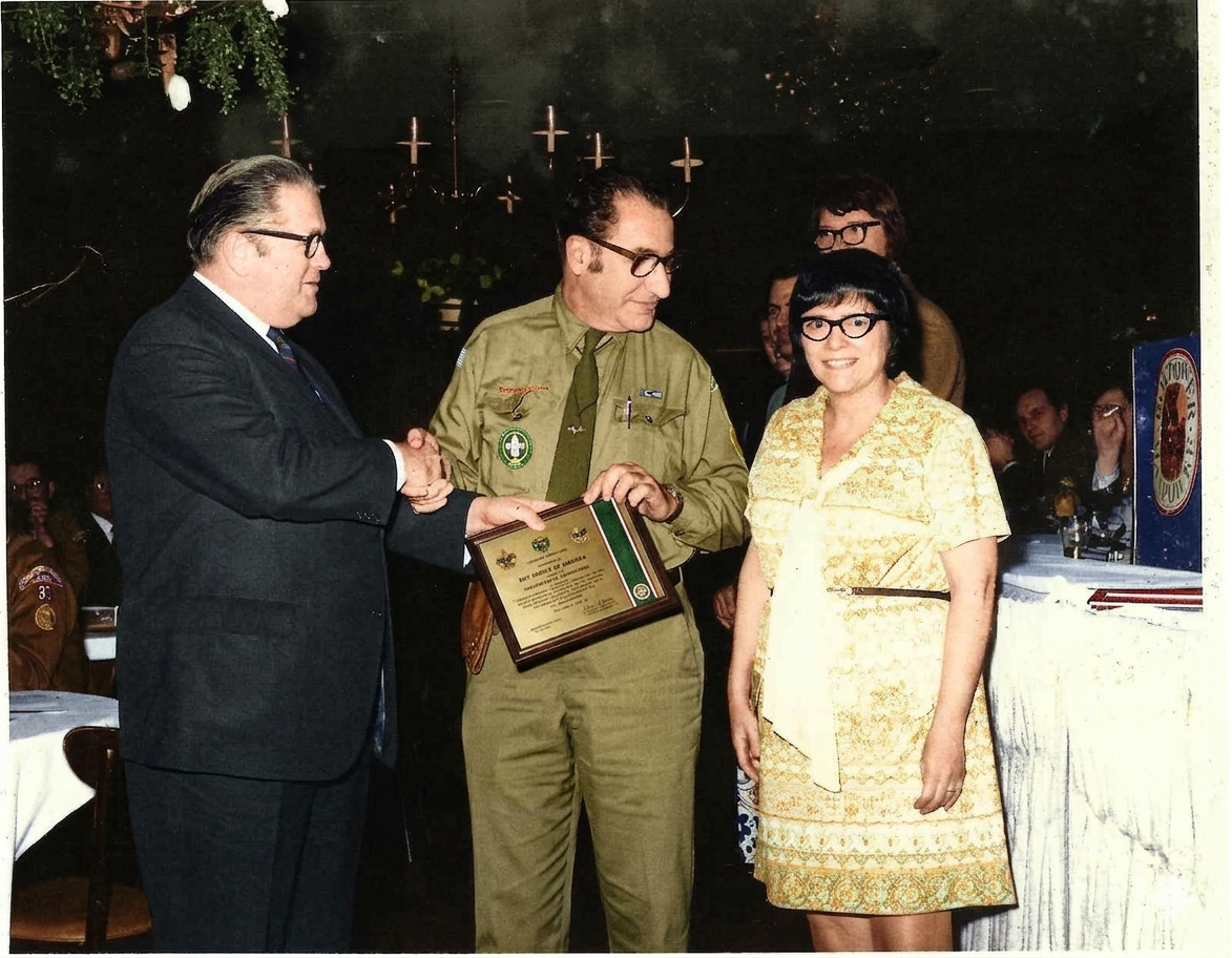 Dr. Edward I. Ciaccio at a Scouting award ceremony with his wife, Concetta, standing beside him.